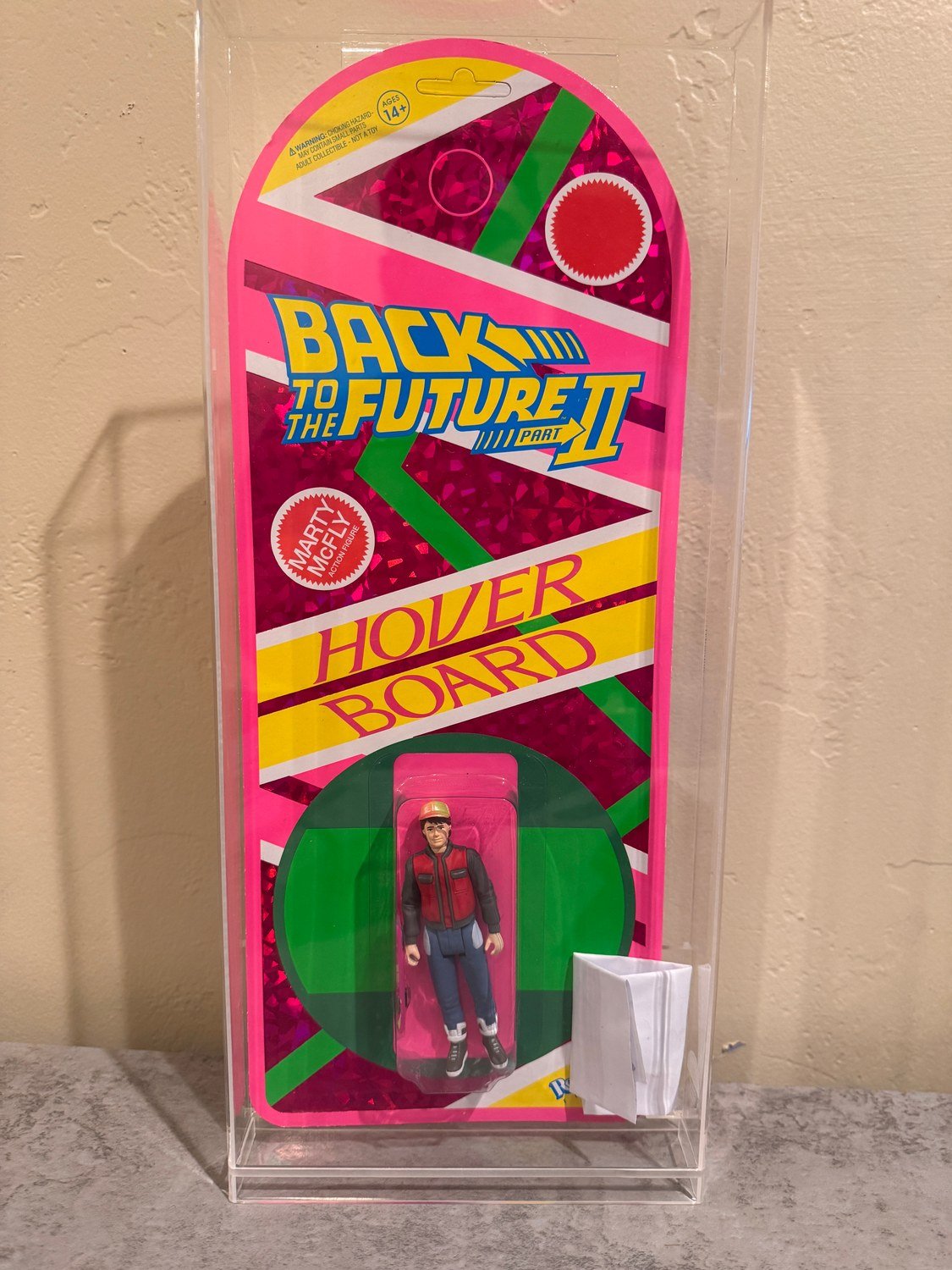 Complete Marty McFly hoverboard collectible in its acrylic display